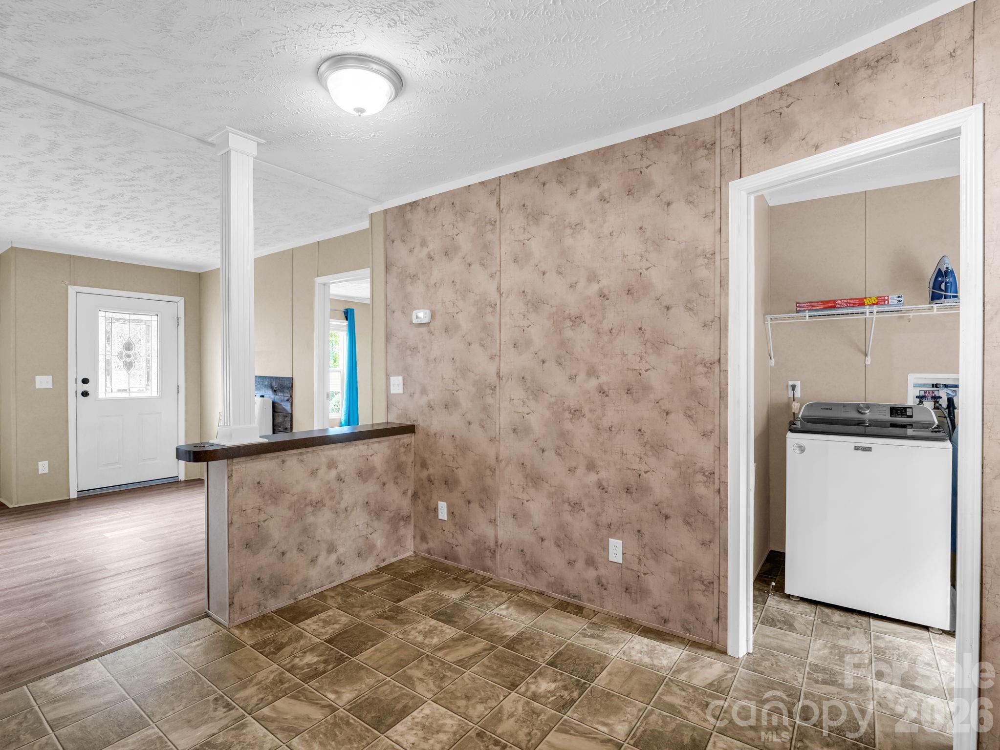 1449 Toney Road Bostic, NC 28018 - Photo 22 of 43 a view of a refrigerator in kitchen and an empty room