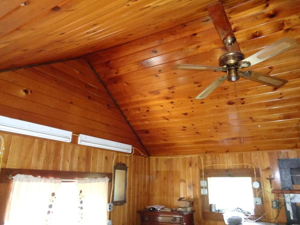 296 Centerville Road Columbia Falls, ME 04623 - Photo 13 of 13 Main room interior of knotty pine...