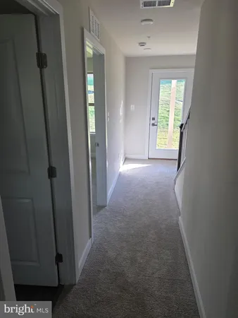 a view of hallway with windows