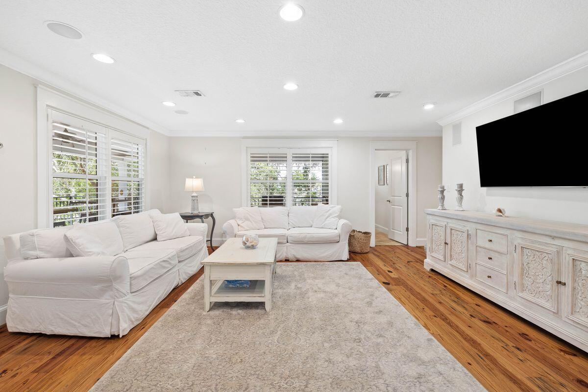 141 Crescent Road Santa Rosa Beach, FL 32459 - Photo 13 of 40 a living room with furniture and a flat screen tv