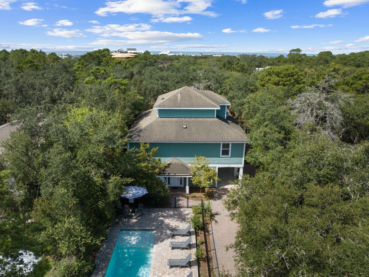 141 Crescent Road Santa Rosa Beach, FL 32459 - Photo 20 of 40 a view of a garden with a house