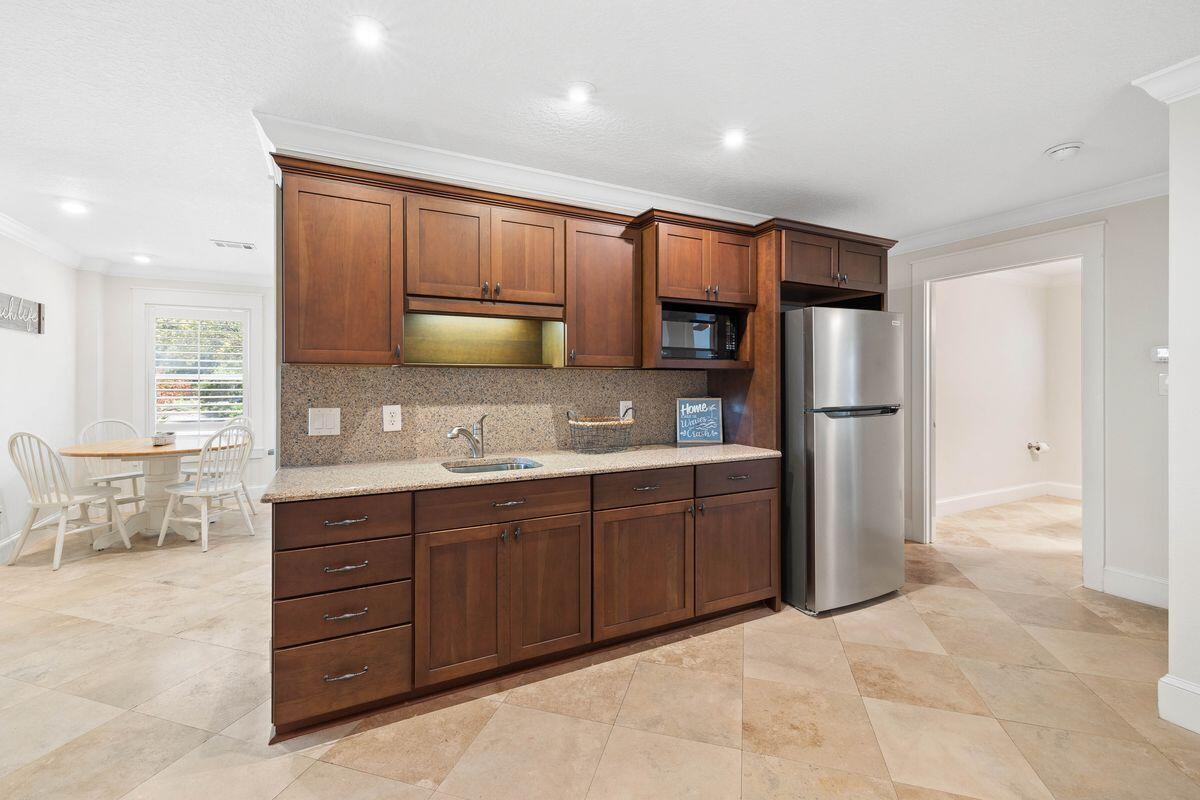 141 Crescent Road Santa Rosa Beach, FL 32459 - Photo 23 of 40 a large kitchen with stainless steel appliances granite countertop a refrigerator and a stove top oven