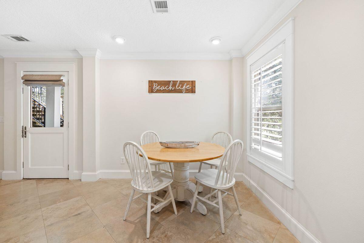 141 Crescent Road Santa Rosa Beach, FL 32459 - Photo 24 of 40 a view of a dining room with furniture and window