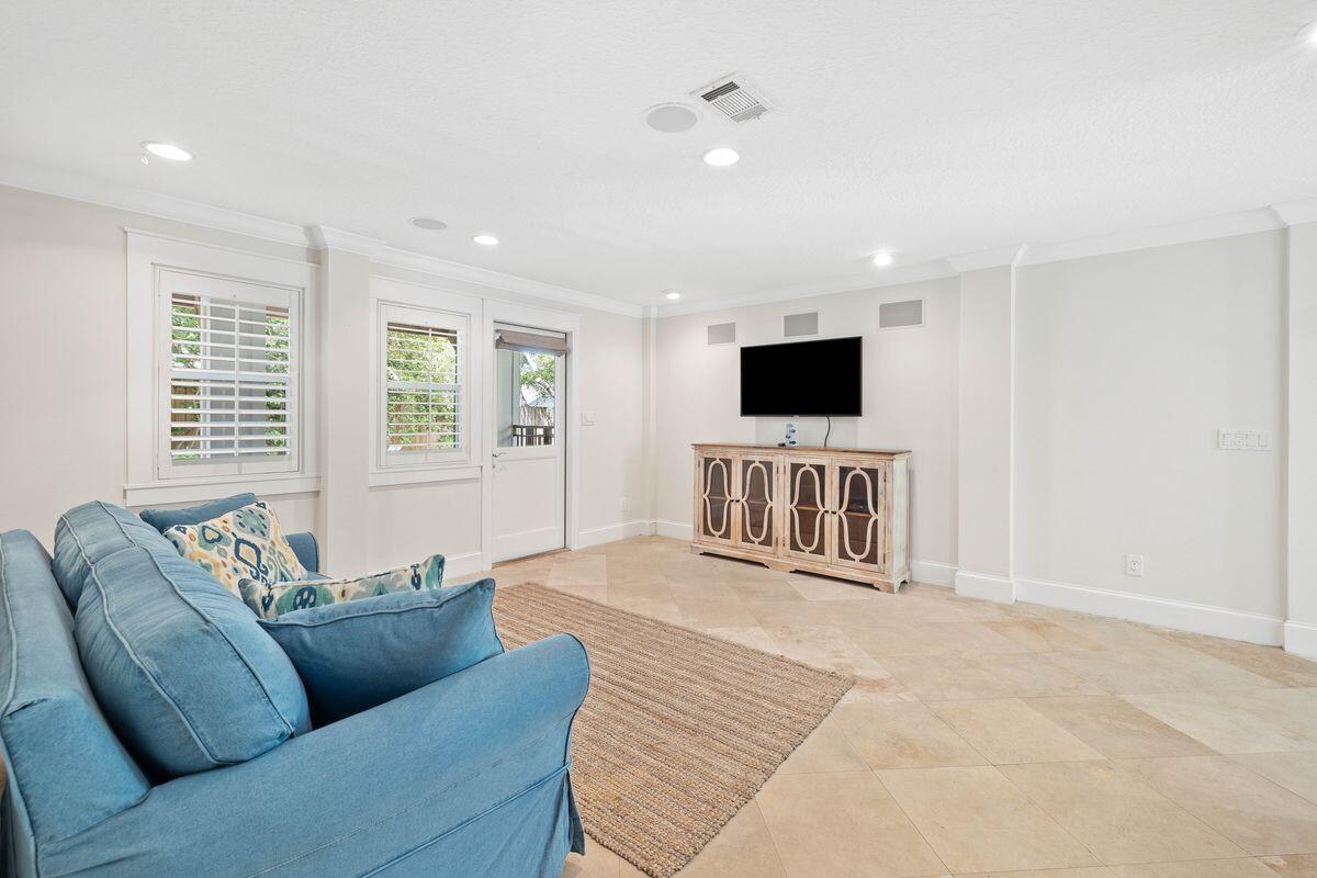 141 Crescent Road Santa Rosa Beach, FL 32459 - Photo 25 of 40 a living room with furniture and a flat screen tv