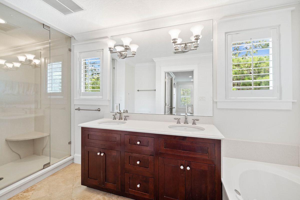 141 Crescent Road Santa Rosa Beach, FL 32459 - Photo 32 of 40 a bathroom with a sink vanity granite tub and a mirror