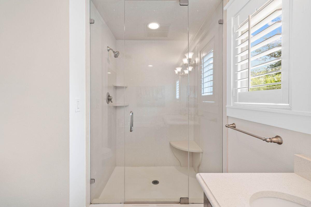 141 Crescent Road Santa Rosa Beach, FL 32459 - Photo 33 of 40 a bathroom with a shower a toilet and a window