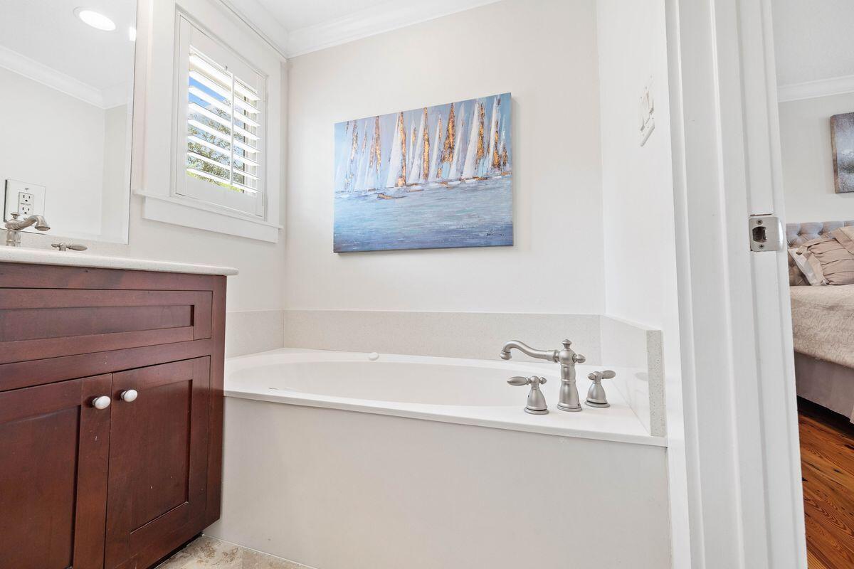 141 Crescent Road Santa Rosa Beach, FL 32459 - Photo 34 of 40 a bathroom with a bathtub sink and mirror