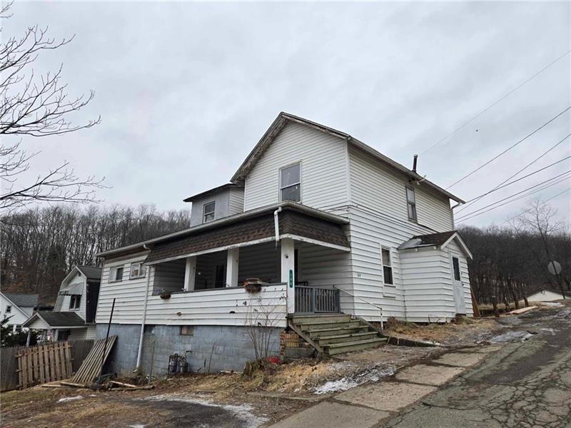 a front view of a house with garage