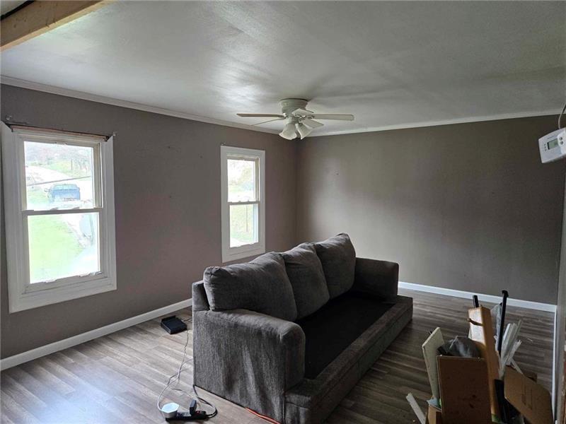 104 Forrest Street Petrolia, PA 16050 - Photo 14 of 22 a living room with furniture and a window