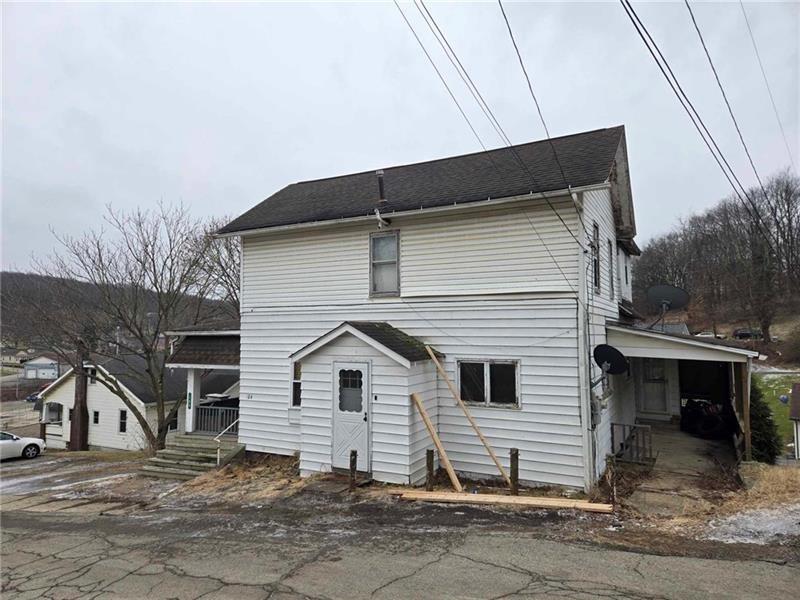 104 Forrest Street Petrolia, PA 16050 - Photo 3 of 22 a view of a house with a yard