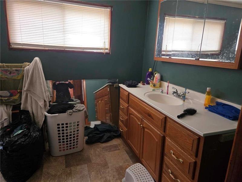 104 Forrest Street Petrolia, PA 16050 - Photo 9 of 22 a room with a window a sink and a table