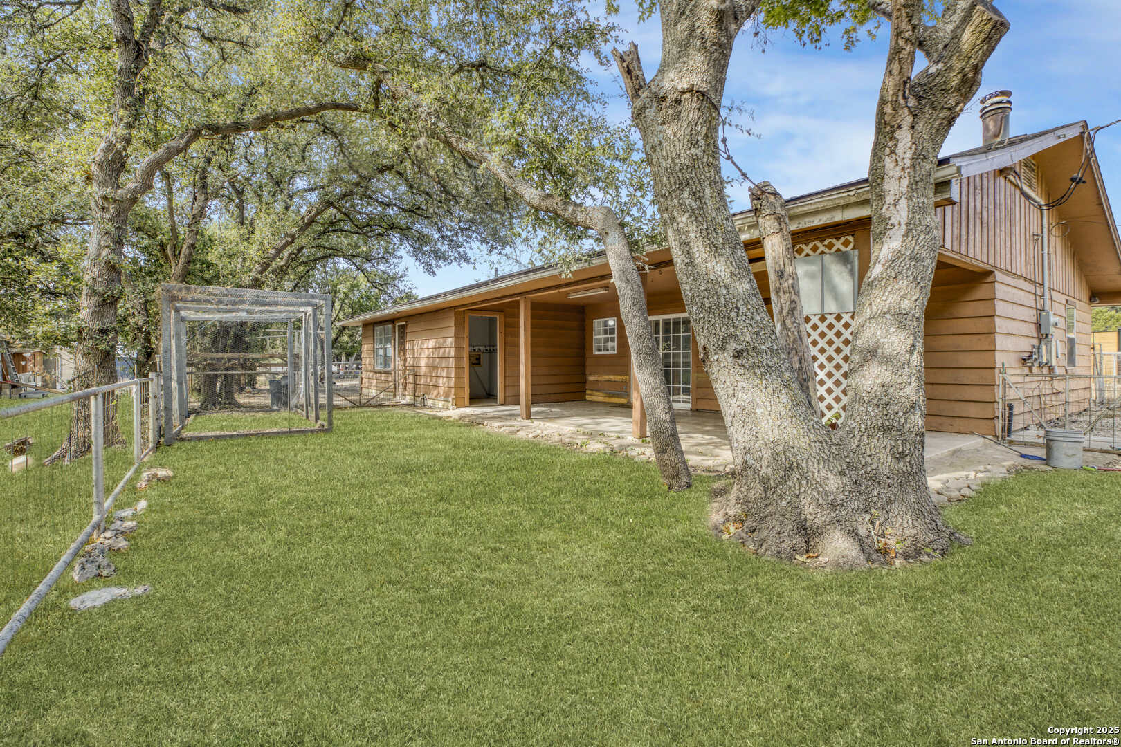 a backyard of a house with lots of green space