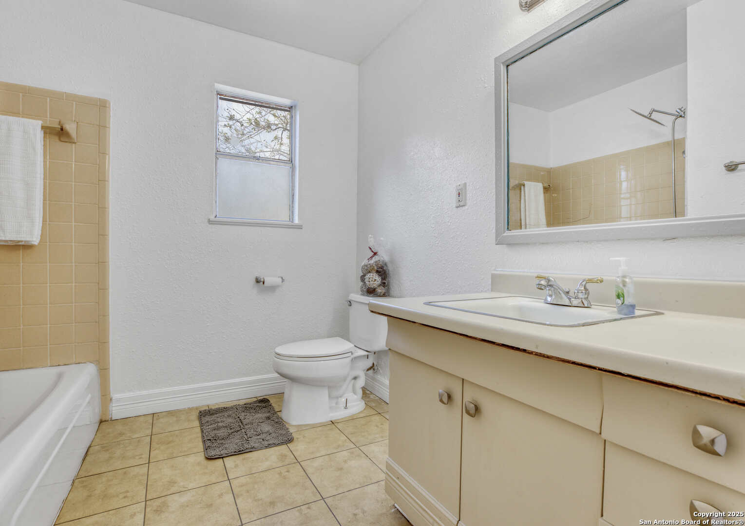 2019 North Park Road Canyon Lake, TX 78133 - Photo 12 of 22 a bathroom with a granite countertop sink toilet and a mirror