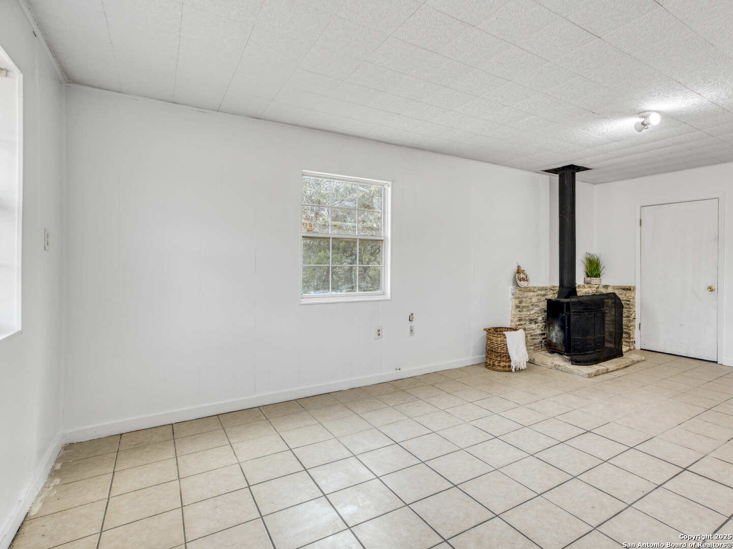 2019 North Park Road Canyon Lake, TX 78133 - Photo 16 of 22 a view of kitchen with refrigerator and window