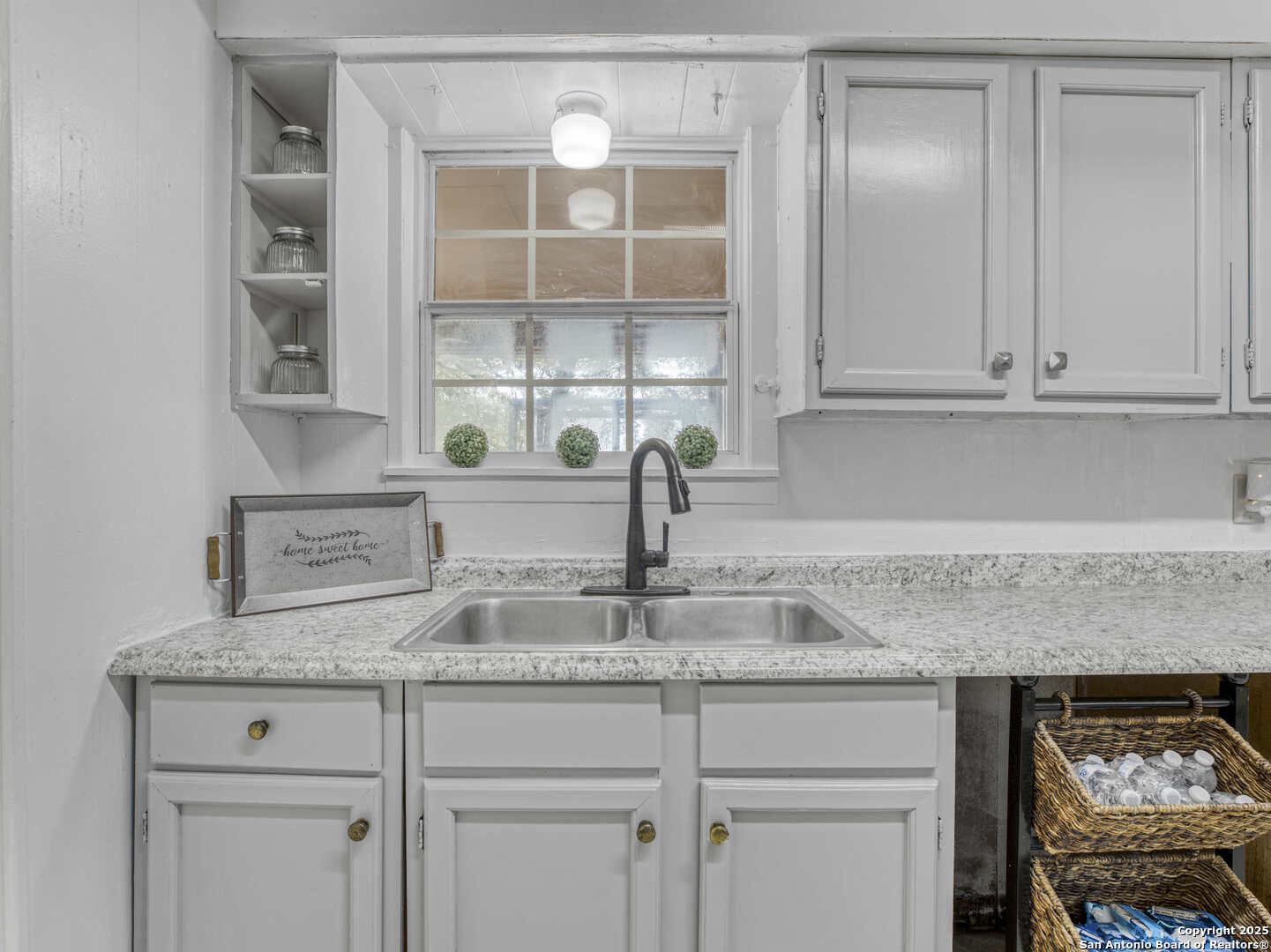 2019 North Park Road Canyon Lake, TX 78133 - Photo 8 of 22 a kitchen with granite countertop a sink and cabinets