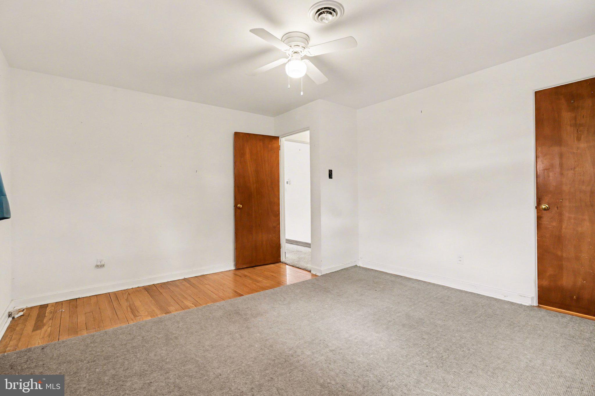 3606 Bonnyview Road Harrisburg, PA 17109 - Photo 12 of 34 an empty room with a ceiling fan and a window
