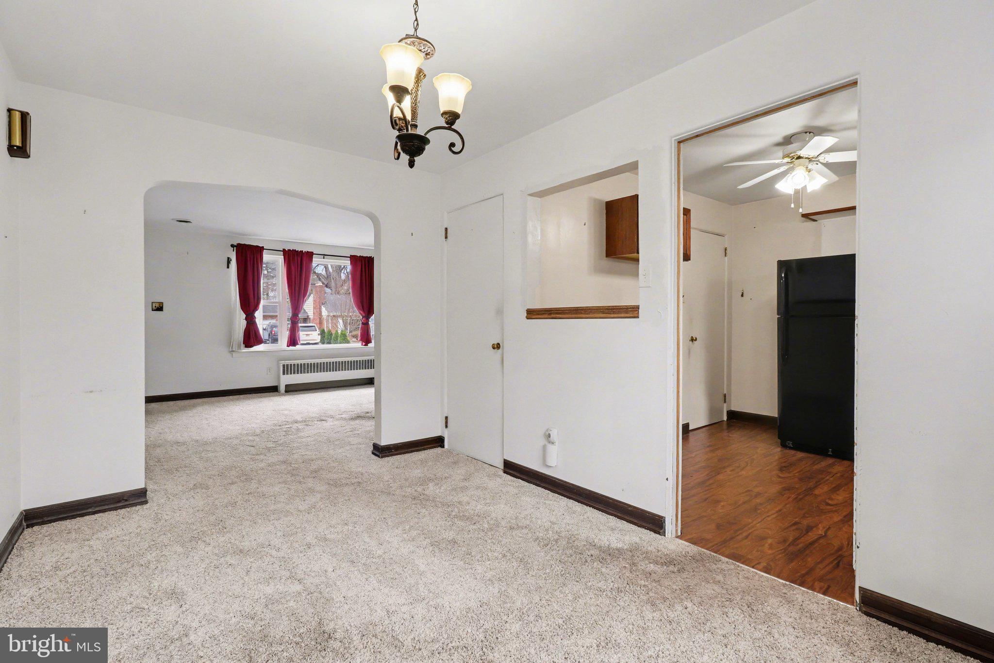 3606 Bonnyview Road Harrisburg, PA 17109 - Photo 21 of 34 a view of a livingroom with wooden floor and chandelier