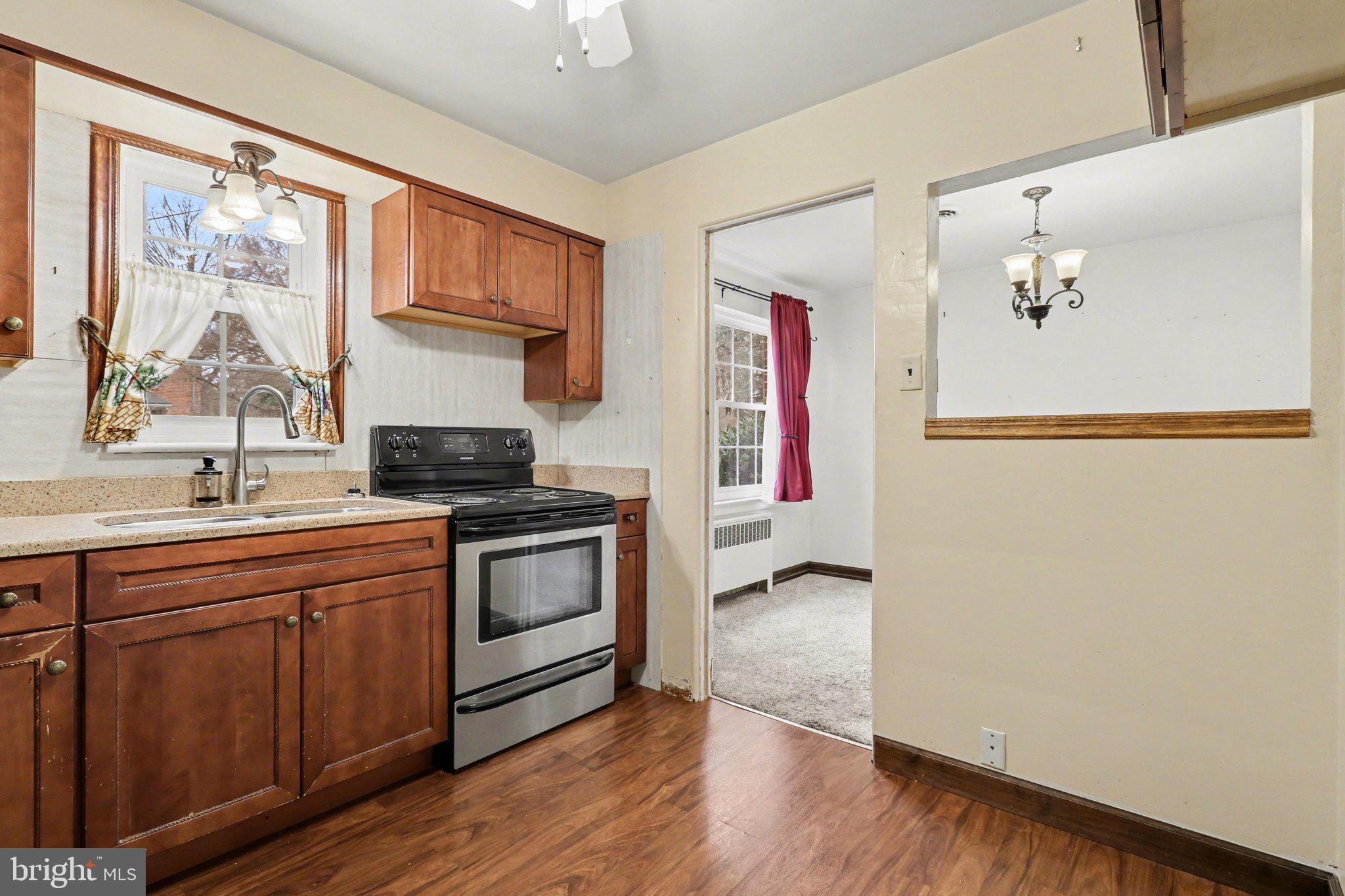 3606 Bonnyview Road Harrisburg, PA 17109 - Photo 6 of 34 a kitchen with stainless steel appliances granite countertop a stove a sink and a refrigerator