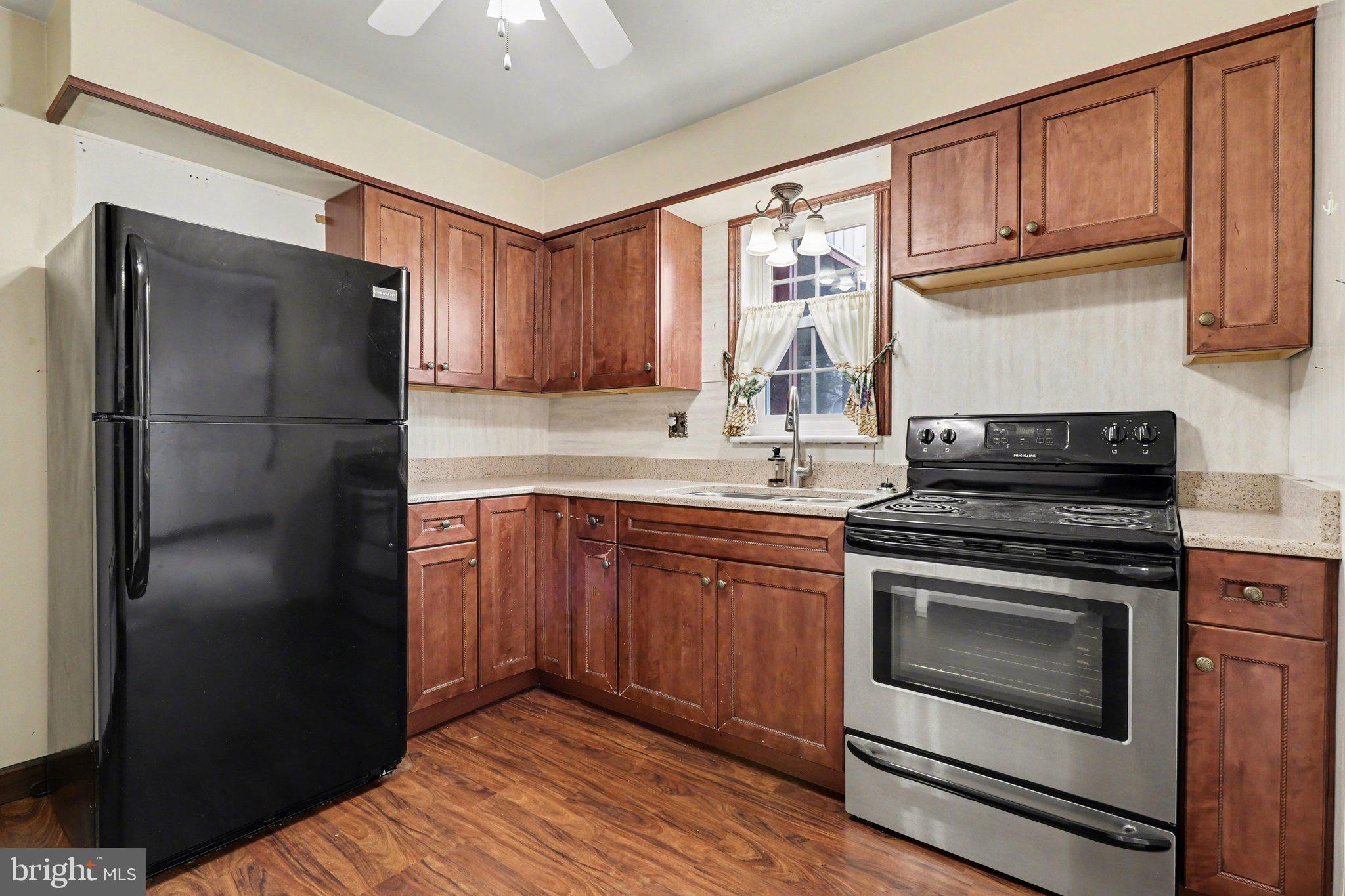 3606 Bonnyview Road Harrisburg, PA 17109 - Photo 7 of 34 a kitchen with a refrigerator stove and sink