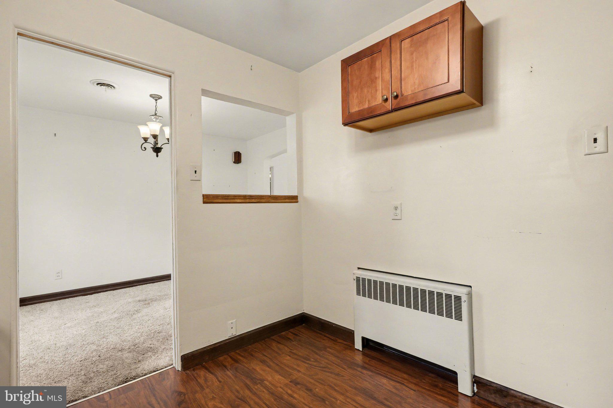 3606 Bonnyview Road Harrisburg, PA 17109 - Photo 8 of 34 a view of a hallway with wooden floor and cabinet