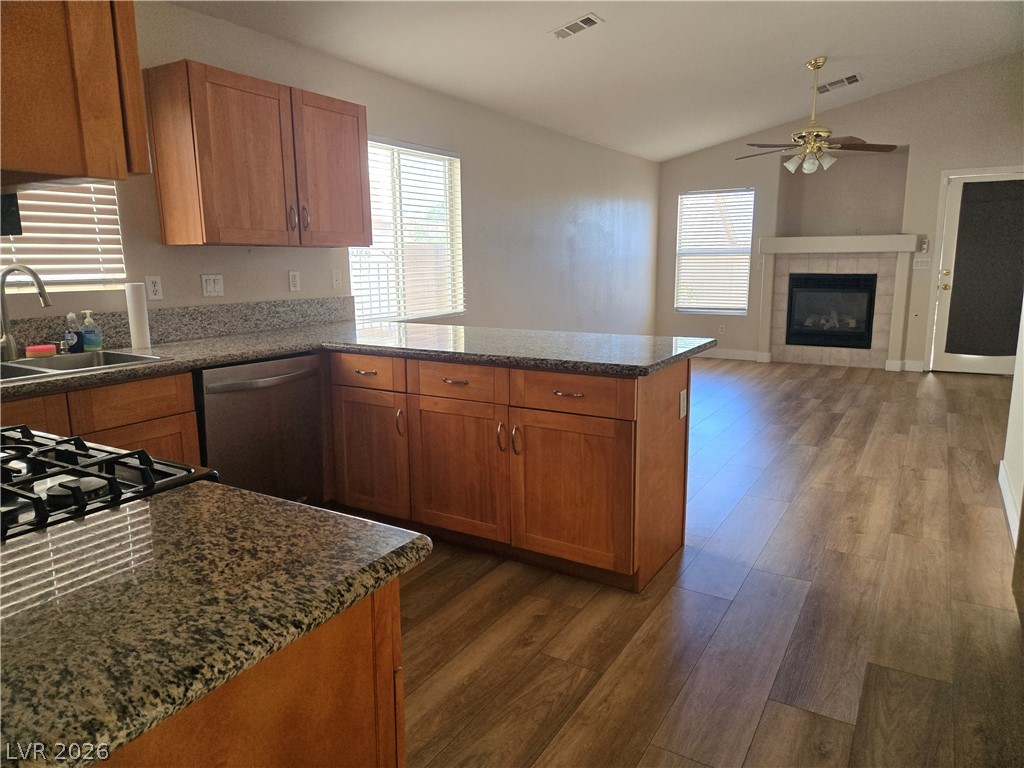 188 Oella Ridge Court Henderson, NV 89012 - Photo 6 of 20 A well-appointed kitchen features granite counters, stainless steel appliances, and a seamless flow into the adjacent living space.