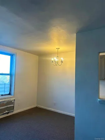 an empty room with a windows