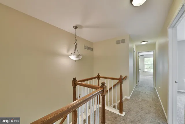 a view of a hallway with an entryway