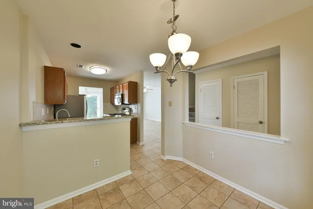 a view of a kitchen and a window