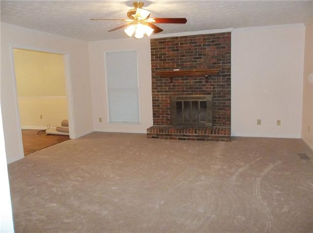 1825 Hidden Ridge Circle Mount Juliet, TN 37122 - Photo 8 of 12 Den with brick wood burning fireplace.