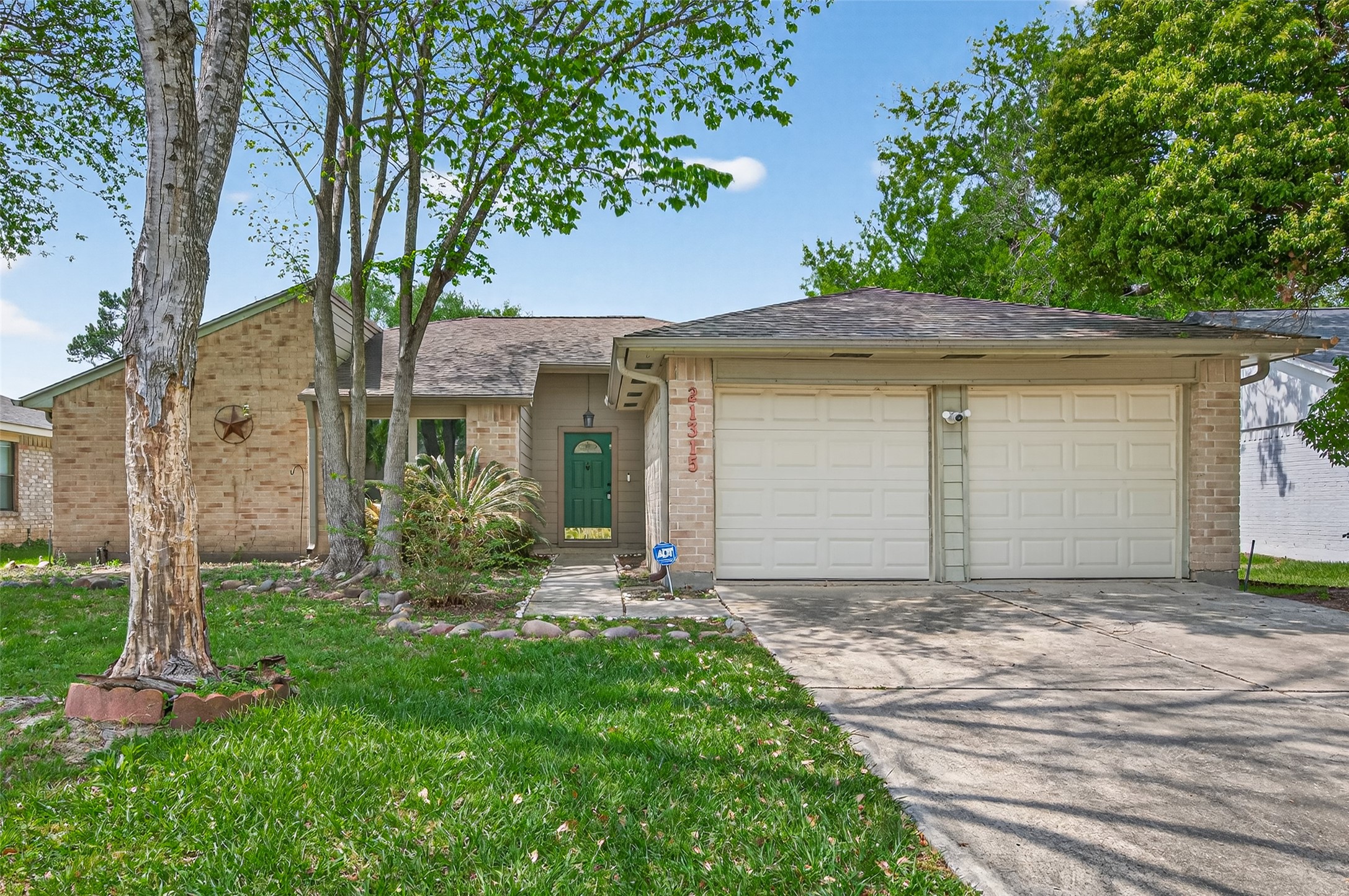 21315 Meadowhill Drive Spring, TX 77388 - Photo 1 of 31 front view of a house with a yard
