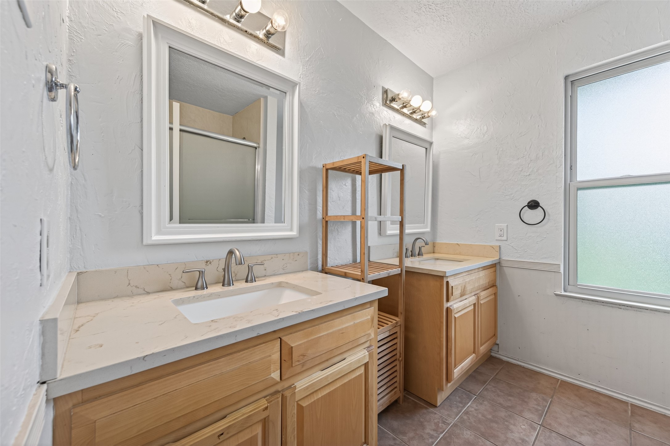 21315 Meadowhill Drive Spring, TX 77388 - Photo 19 of 31 a bathroom with a sink and a mirror