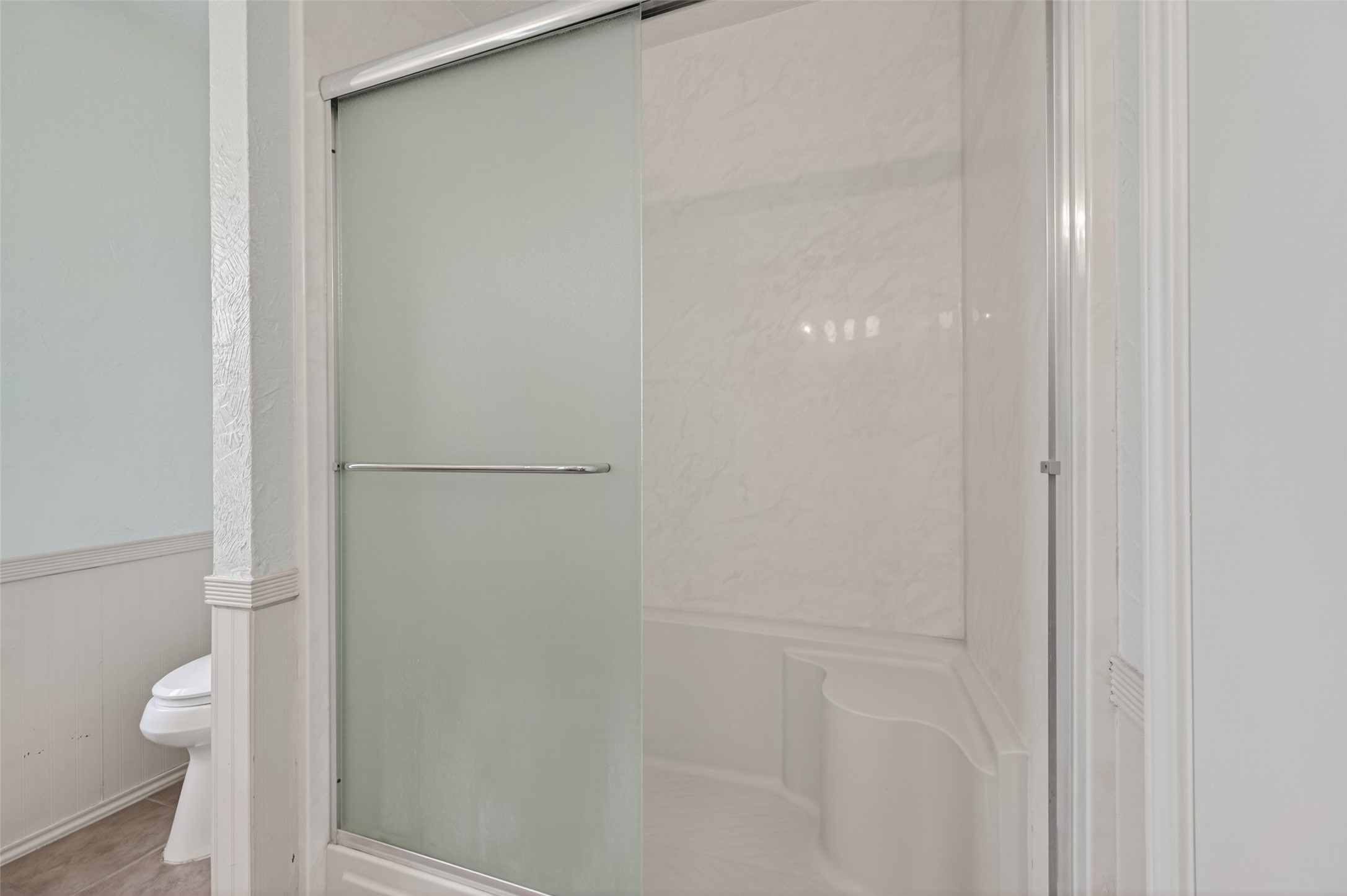 21315 Meadowhill Drive Spring, TX 77388 - Photo 21 of 31 a bathroom with a granite countertop toilet and a shower