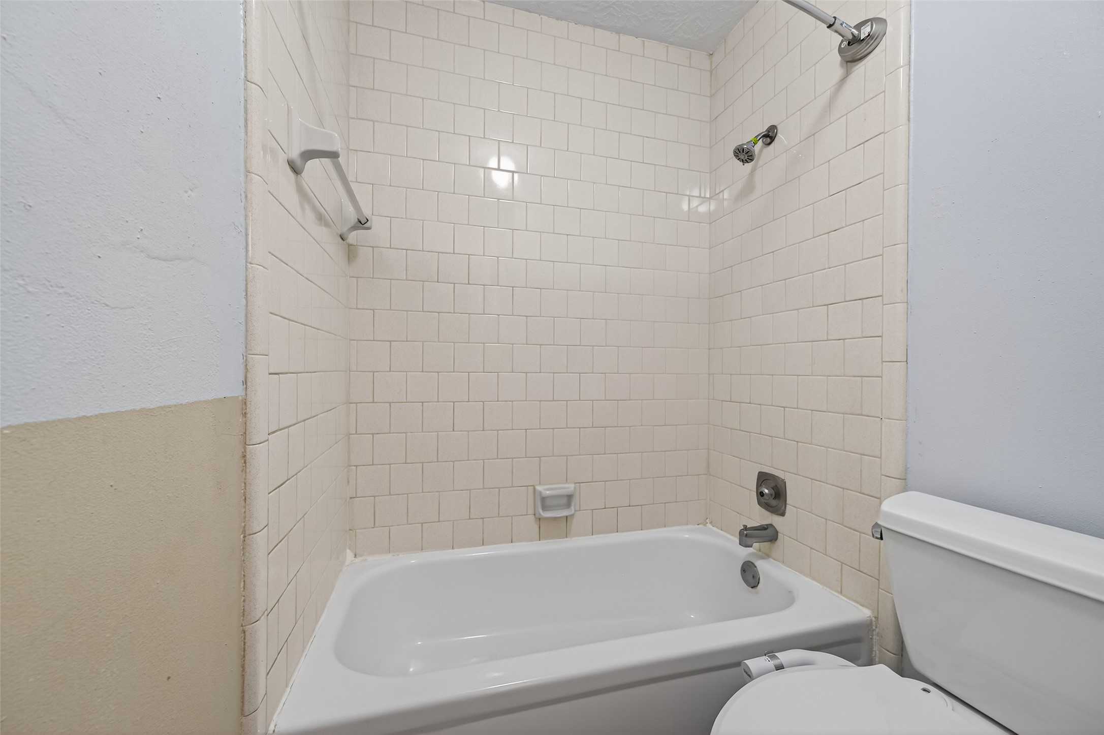 21315 Meadowhill Drive Spring, TX 77388 - Photo 25 of 31 a white bath tub sitting next to a white toilet and sink