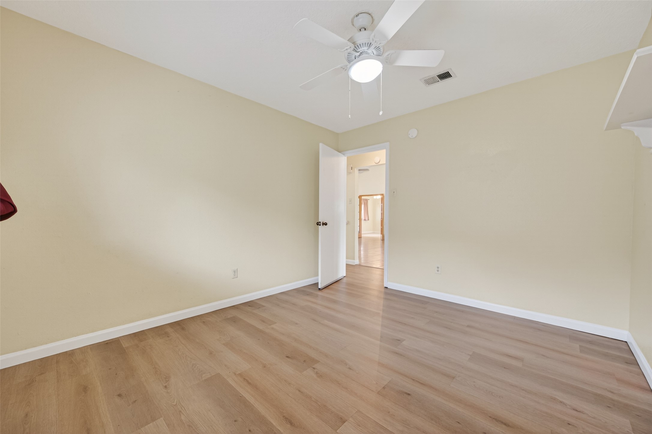 21315 Meadowhill Drive Spring, TX 77388 - Photo 27 of 31 an empty room with wooden floor and windows