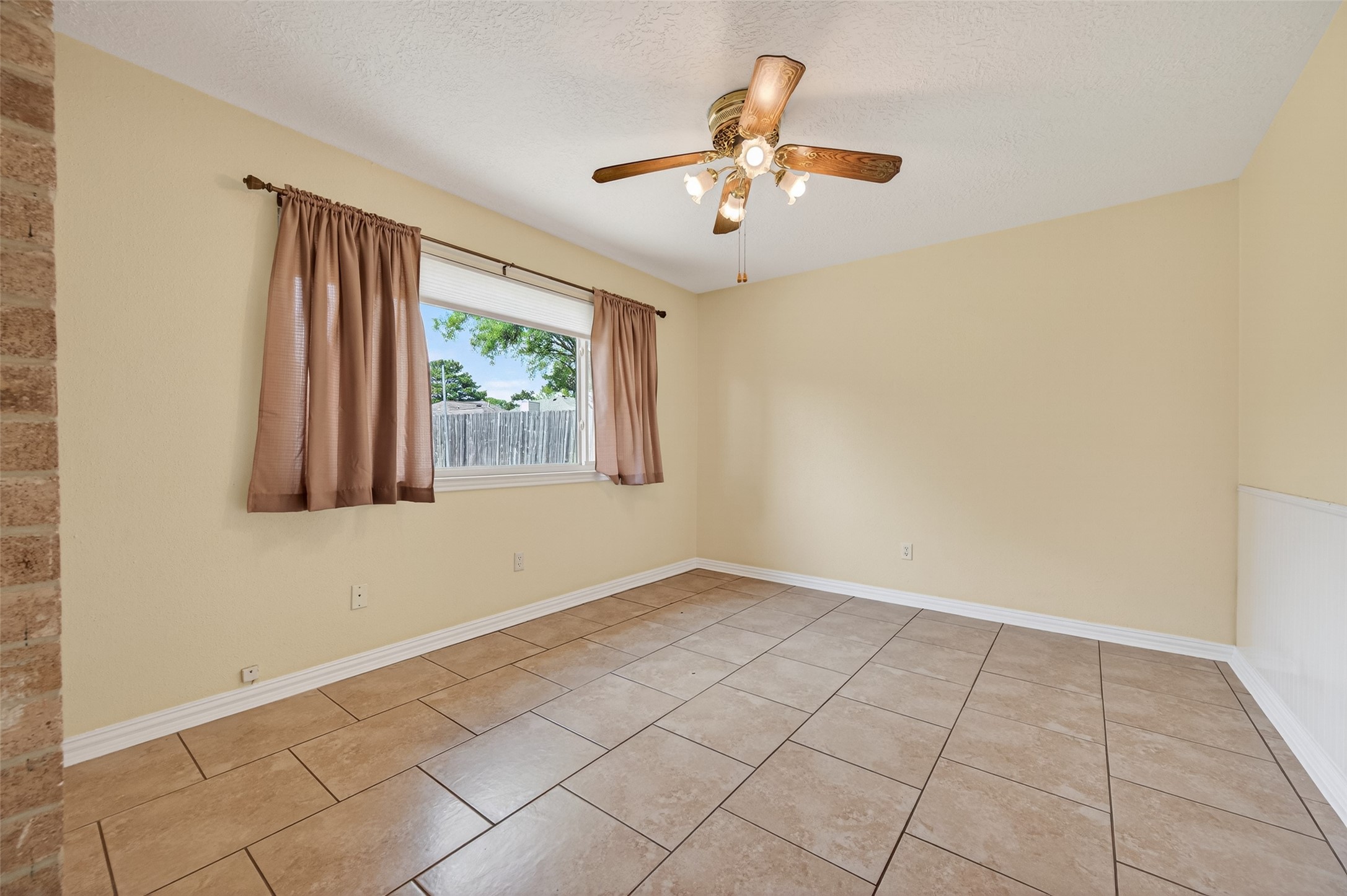 21315 Meadowhill Drive Spring, TX 77388 - Photo 6 of 31 an empty room with windows and ceiling fan