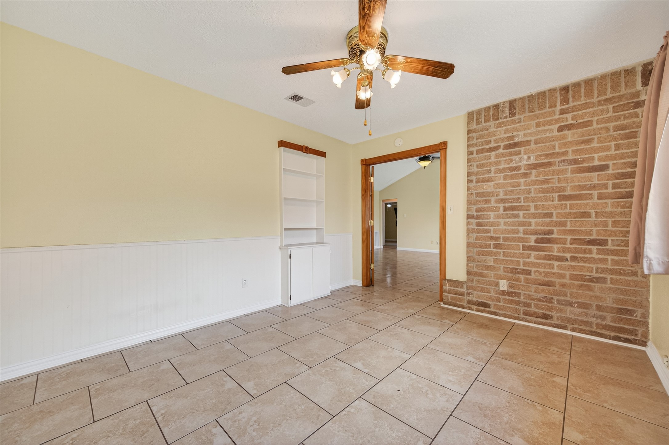 21315 Meadowhill Drive Spring, TX 77388 - Photo 7 of 31 a view of a livingroom with an empty space and a ceiling fan