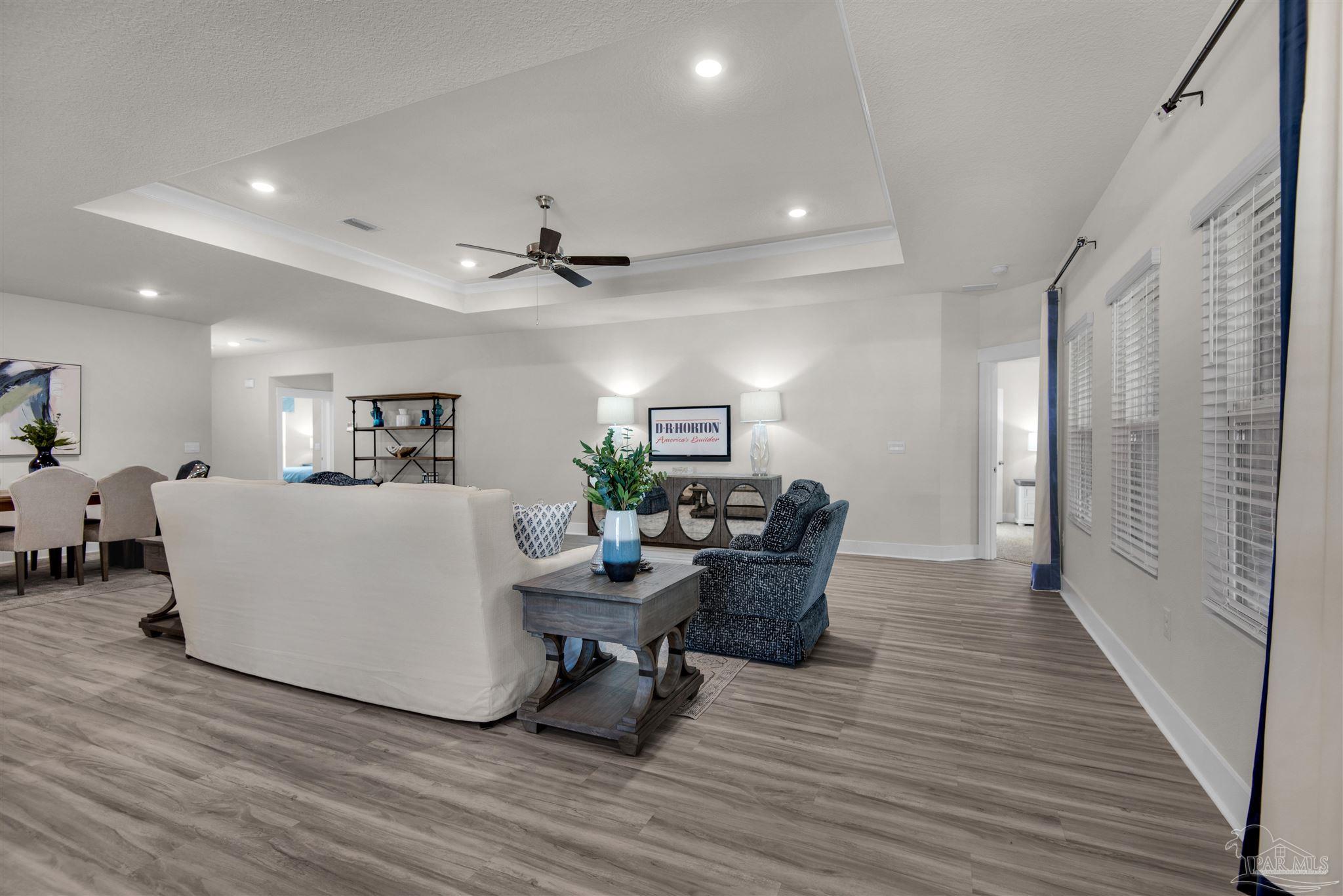 3287 Water Birch Road Cantonment, FL 32533 - Photo 18 of 45 a living room with furniture and a wooden floor