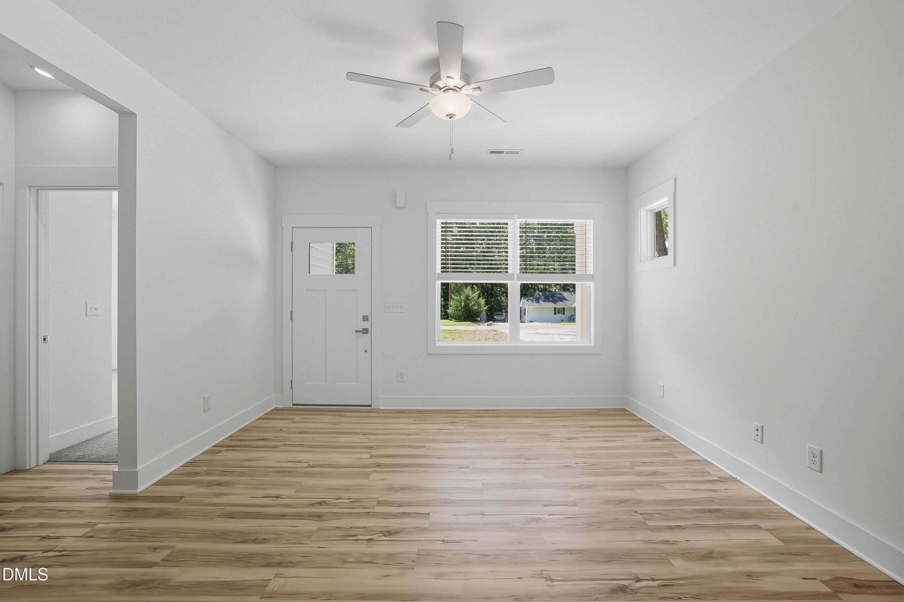 97 Gates Street Roxboro, NC 27573 - Photo 14 of 34 wooden floor in an empty room with a window