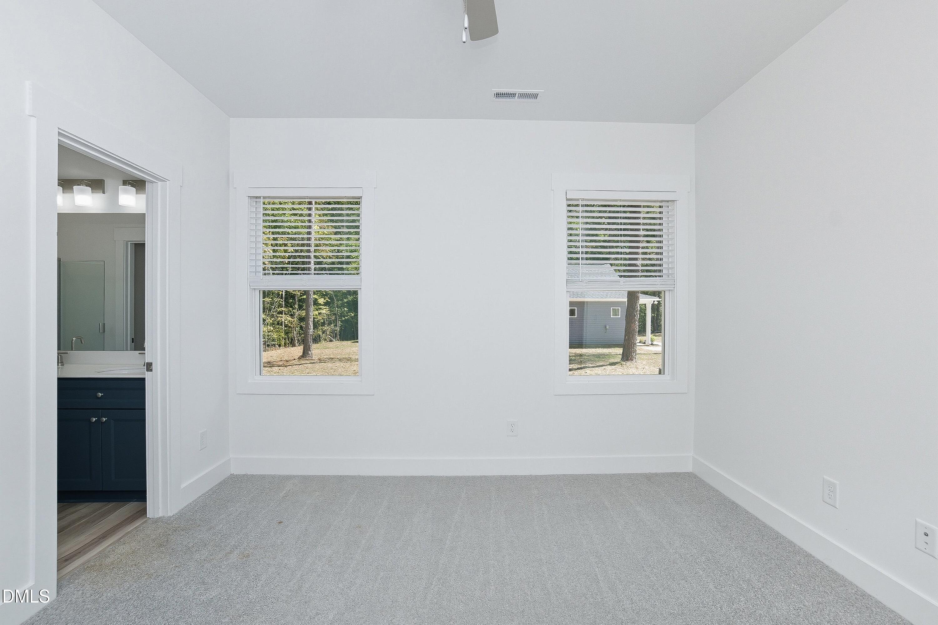97 Gates Street Roxboro, NC 27573 - Photo 18 of 34 an empty room with windows