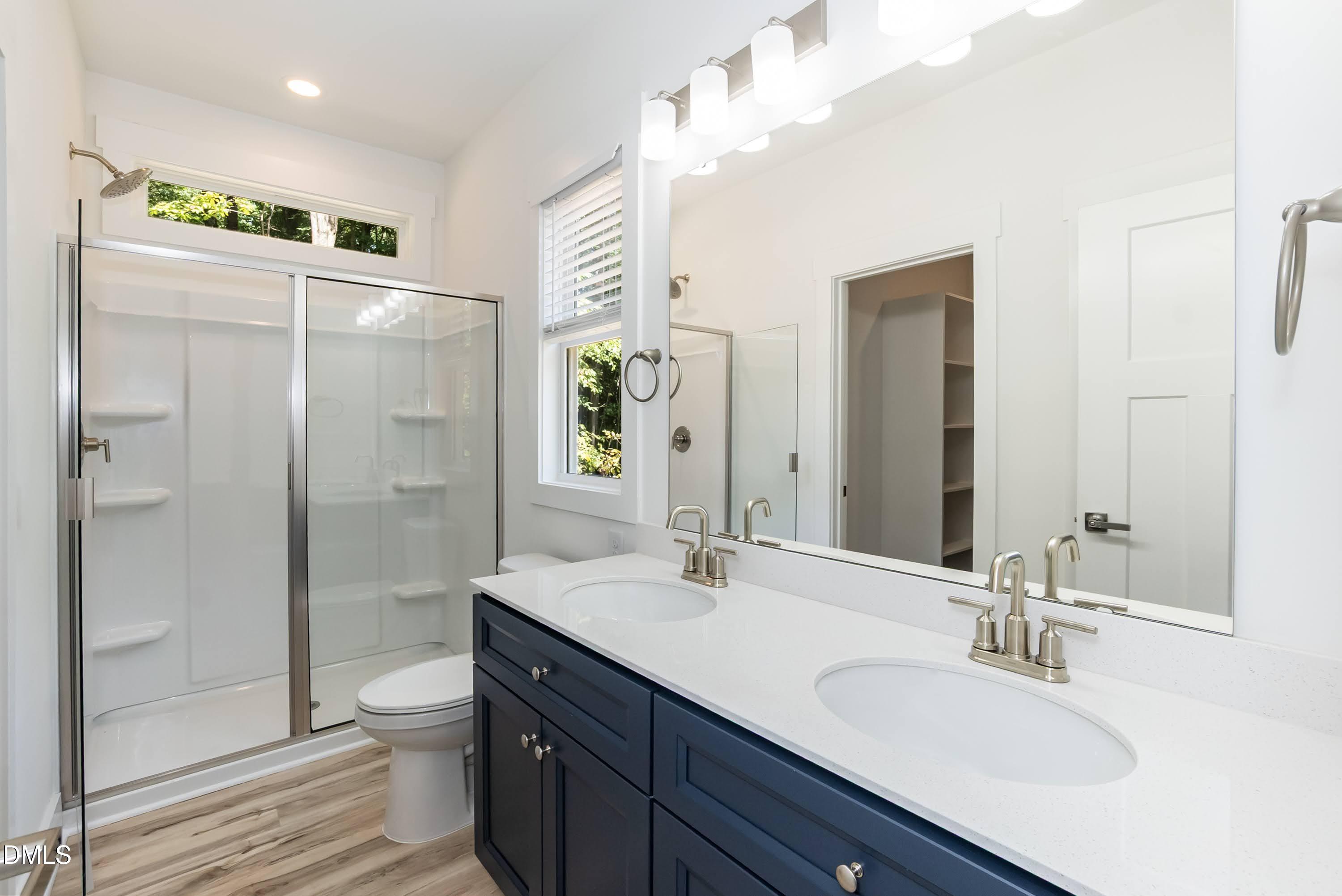 97 Gates Street Roxboro, NC 27573 - Photo 20 of 34 a bathroom with a sink a toilet and shower