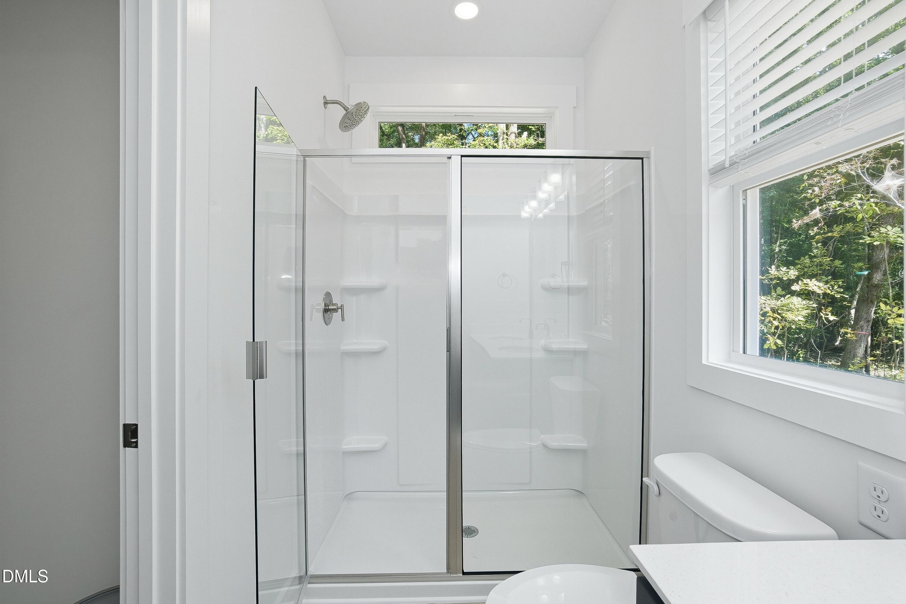 97 Gates Street Roxboro, NC 27573 - Photo 21 of 34 a bathroom with a shower and a sink