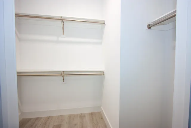 a view of an empty walk in closet