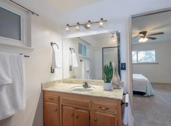 a bathroom with a double vanity sink and a mirror