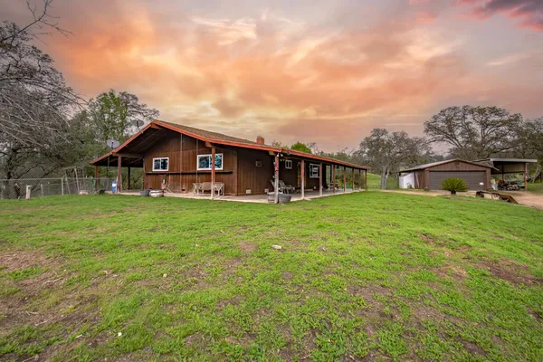 a view of a house with a big yard