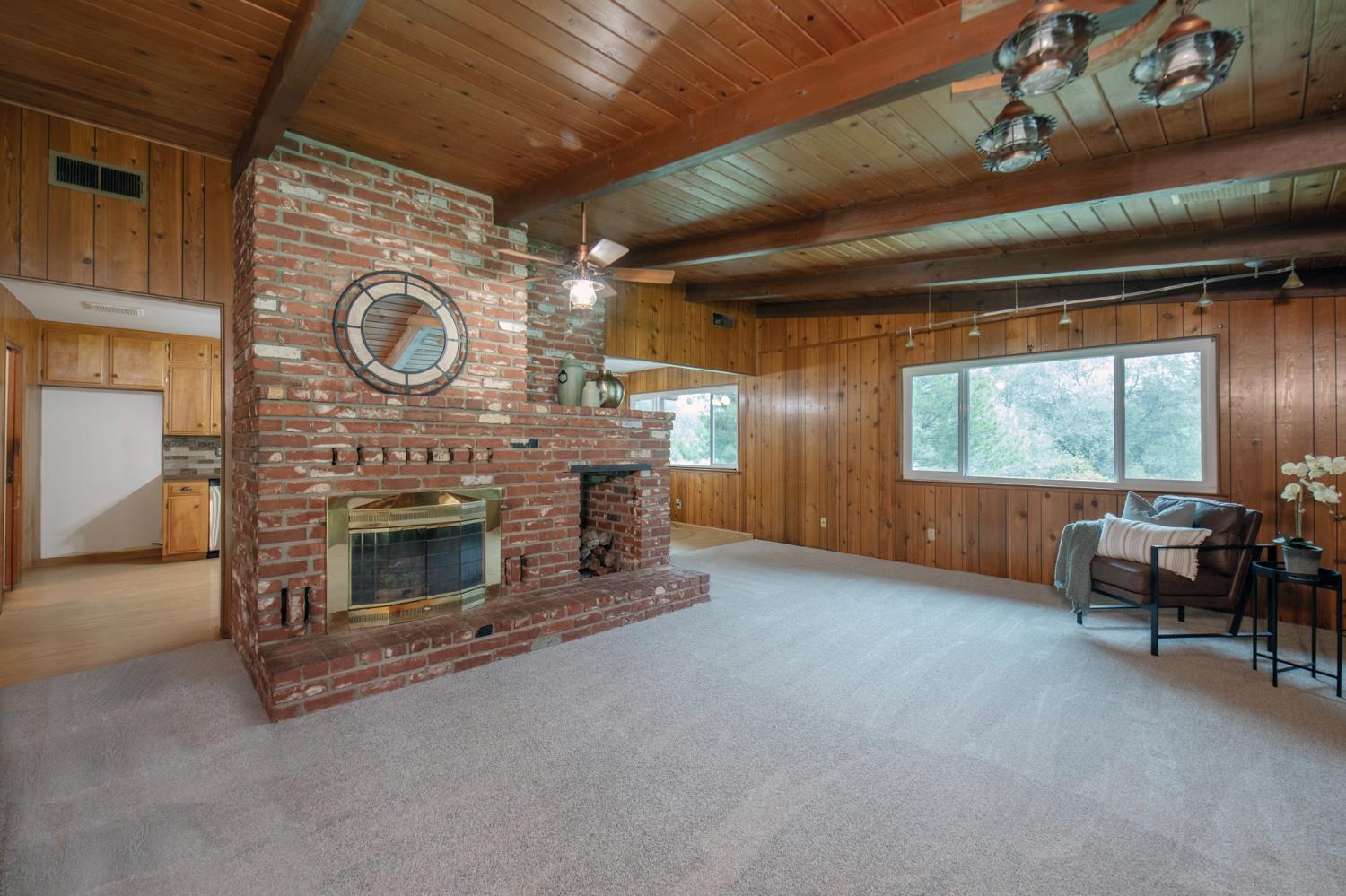 21256 Tollhouse Road Clovis, CA 93619 - Photo 4 of 30 a living room with furniture and a fireplace
