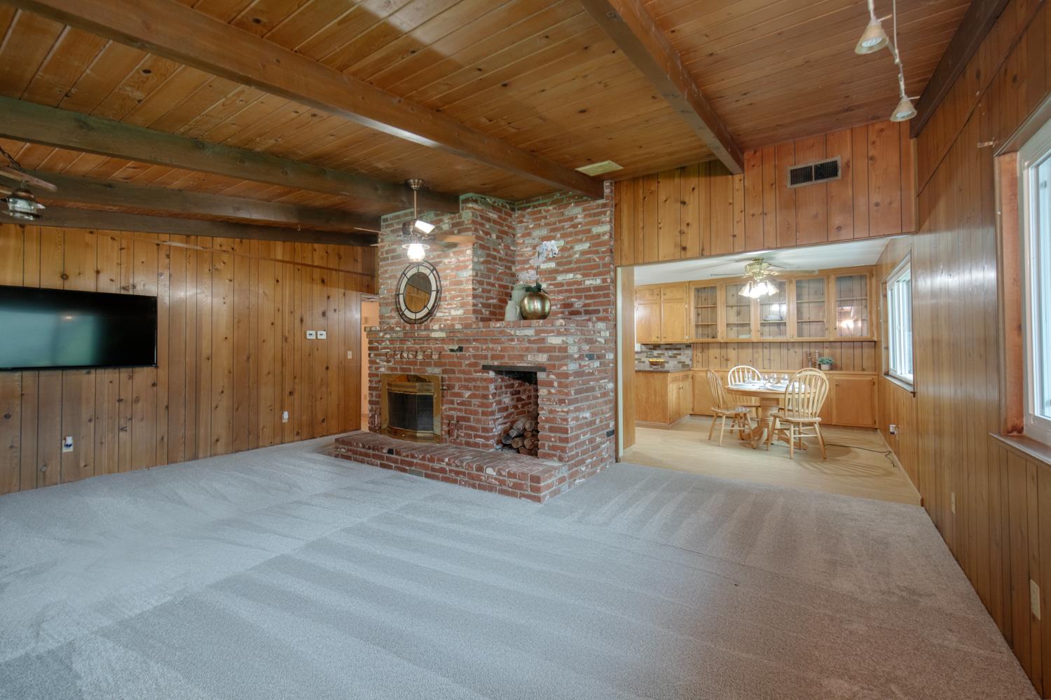 21256 Tollhouse Road Clovis, CA 93619 - Photo 5 of 30 a view of a livingroom with fireplace and furniture