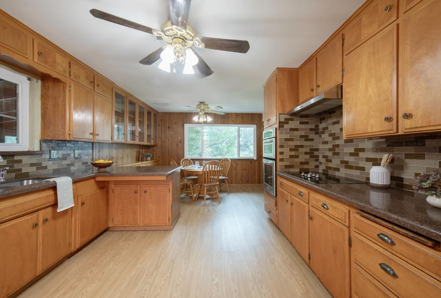 21256 Tollhouse Road Clovis, CA 93619 - Photo 6 of 30 a kitchen with sink cabinets and window