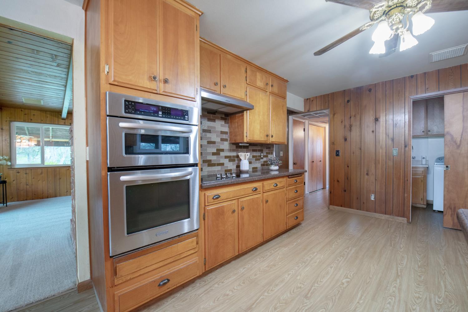 21256 Tollhouse Road Clovis, CA 93619 - Photo 9 of 30 a kitchen with stainless steel appliances granite countertop a stove and cabinets