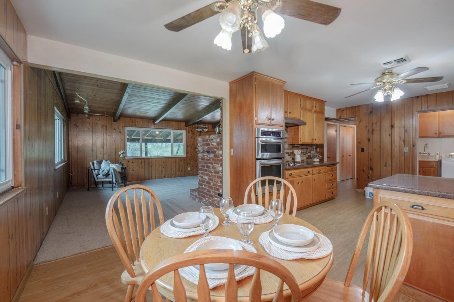 21256 Tollhouse Road Clovis, CA 93619 - Photo 10 of 30 a dining room with furniture a chandelier and window
