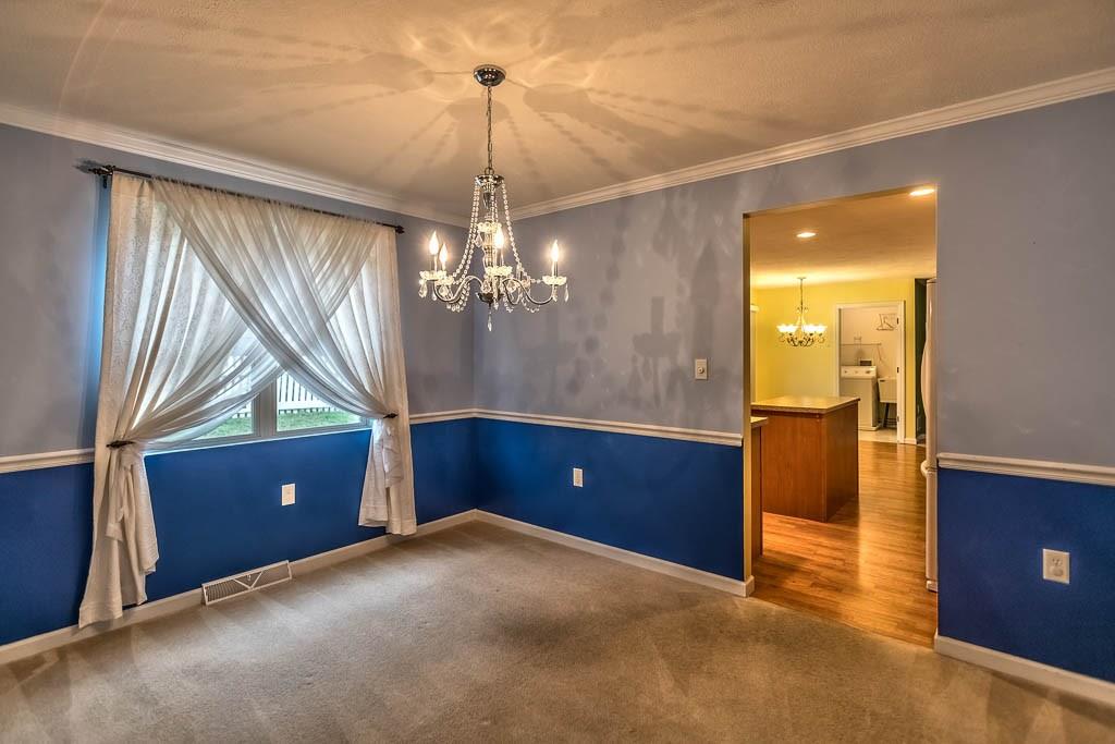 10288 Rinaman Road Wexford, PA 15090 - Photo 5 of 25 Dining Room - Elegant Chandelier - Crown Molding and Chair Rail